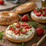 Toasted bagels with cottage cheese, strawberries, and honey, perfect for a healthy breakfast.