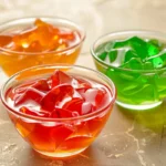 3 ingredient jello weight loss recipe in clear glass cups showing bright red orange and green colors with firm texture