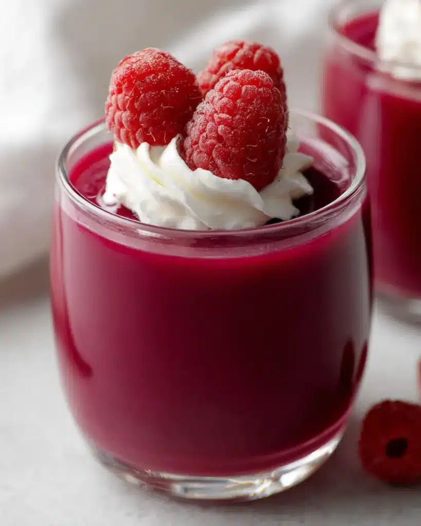 final fluffy jello recipe protein with Greek yogurt topped with fresh raspberries ready to eat