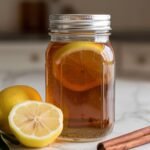 Sealed glass jar of the finished ben carson honey recipe showing deep golden amber cinnamon honey blend ready to rest 24 hours