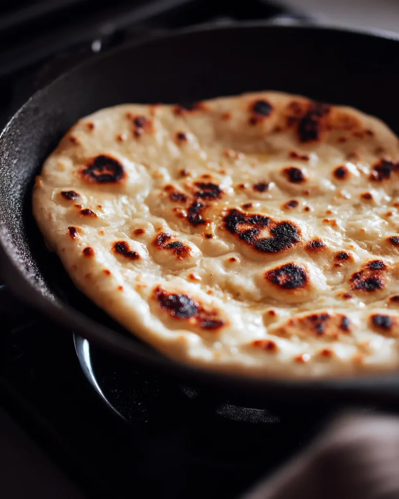 fast naan bread bubbling in skillet