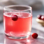 what is the gelatin trick gelatide is based on shown as warm pink gelatin drink in clear glass on white marble