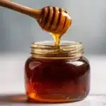 best tualang honey recipe dark amber jar marble surface natural light