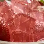 dr william li gelatin recipe for weight loss pink wobbly cubes served in white ceramic bowl with fresh strawberries