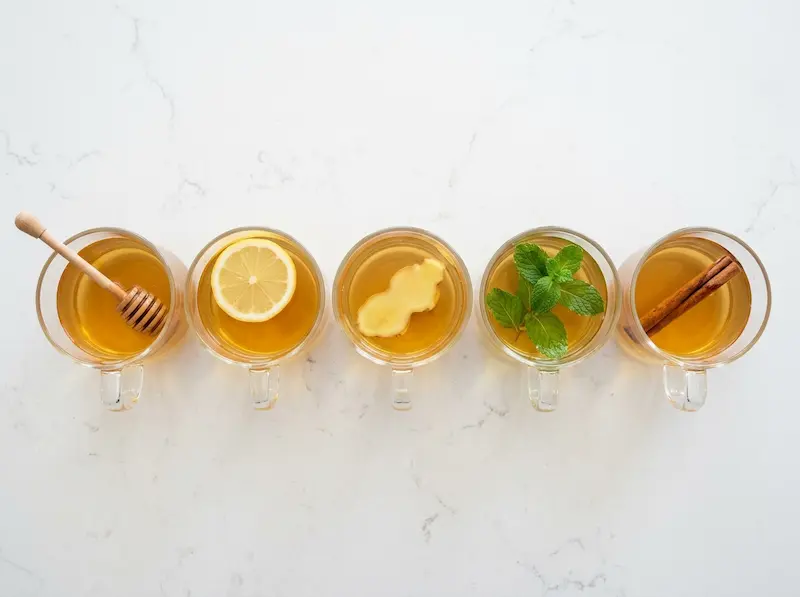 Fennel Seed Tea Variations five glass mugs of fennel seed tea variations with honey lemon ginger mint and cinnamon