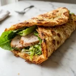 Golden baked cottage cheese flatbread wrap filled with turkey